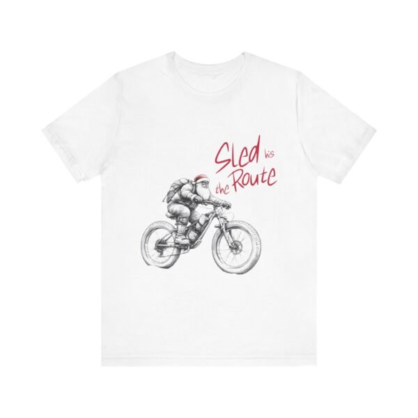 WickerStudio Santa is on his way Unisex Tee, Christmas Graphic T-Shirt, Holiday Santa Shirt, Gift for Christmas Lovers